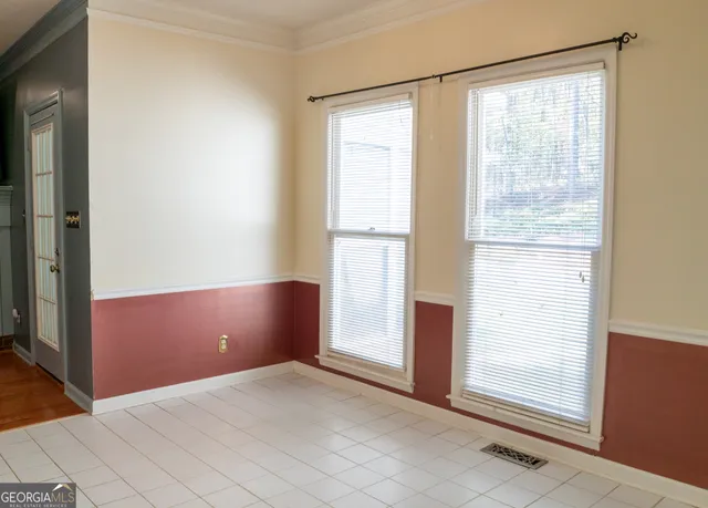 a view of empty room with windows