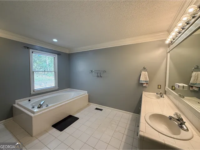 a room with a bed and window