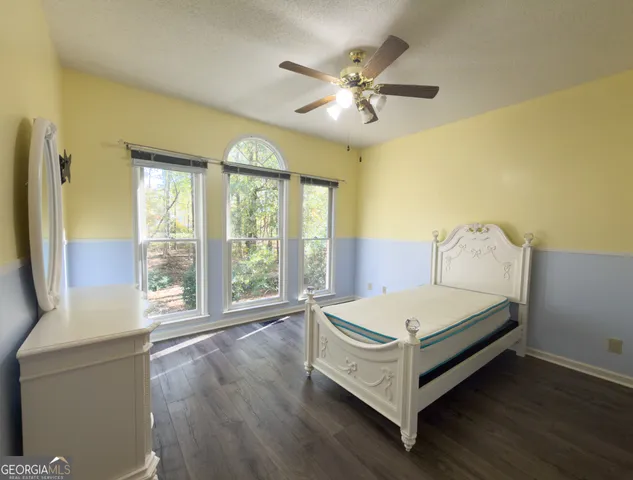 a view of hallway with wooden floor