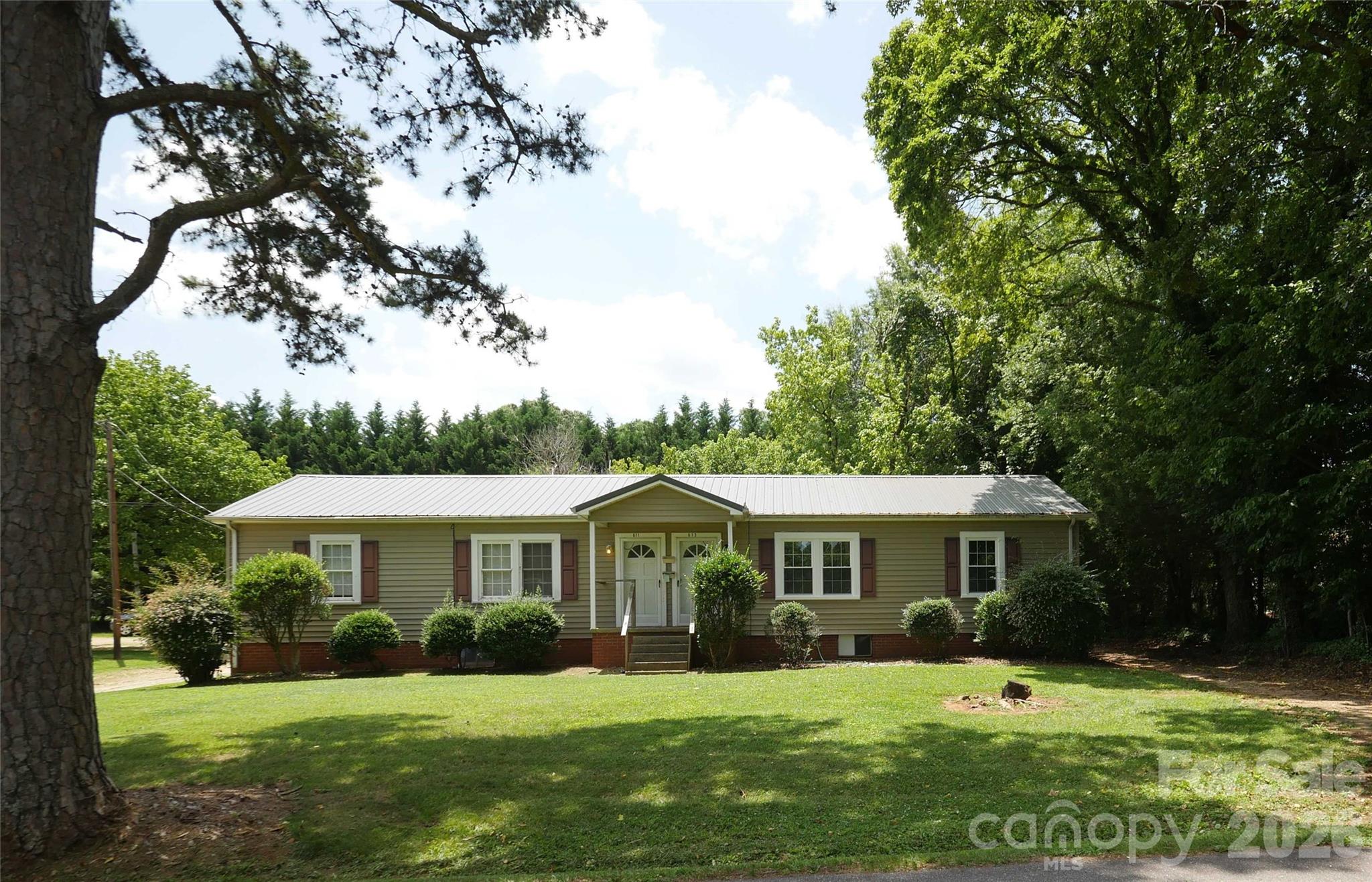 611 6th Street Southwest Conover, NC 28613 - Photo 1 of 1 a front view of a house with a yard table and chairs
