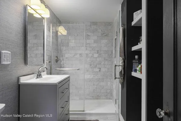 a bathroom with a sink and a mirror