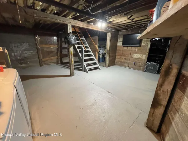 a view of empty room with stairs