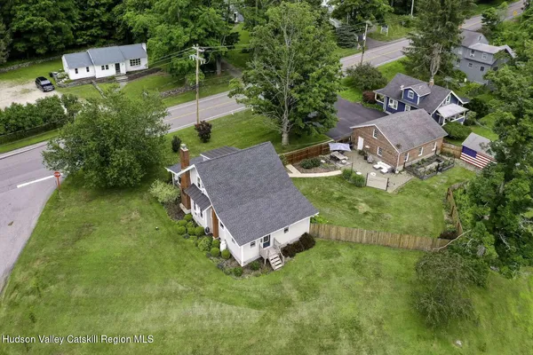 an aerial view of a house with a garden