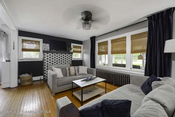 a living room with furniture and a large window