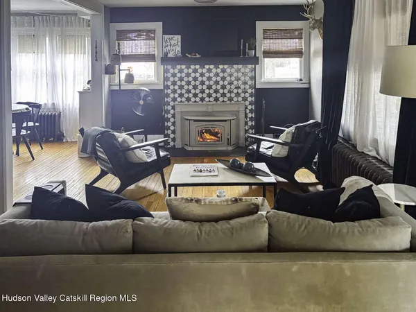 a living room with furniture and a fireplace