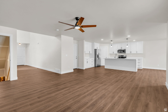 576 7th Avenue Midvale, UT 84047 - Photo 4 of 32 Unfurnished living room featuring a ceiling fan, dark wood-style flooring, and recessed lighting