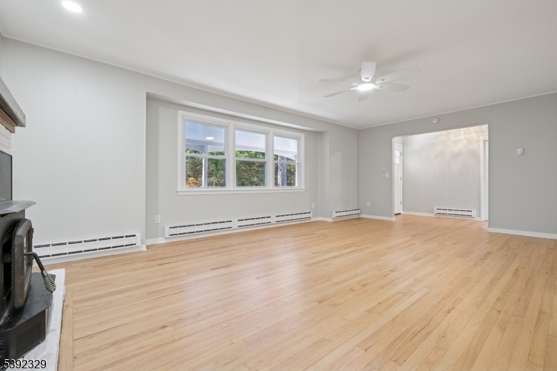 5 Weatherhill Road Lebanon, NJ 08833 - Photo 12 of 47 an empty room with wooden floor and windows