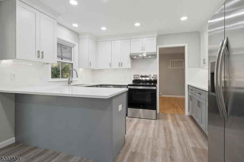 5 Weatherhill Road Lebanon, NJ 08833 - Photo 14 of 47 a kitchen with stainless steel appliances a refrigerator sink and stove