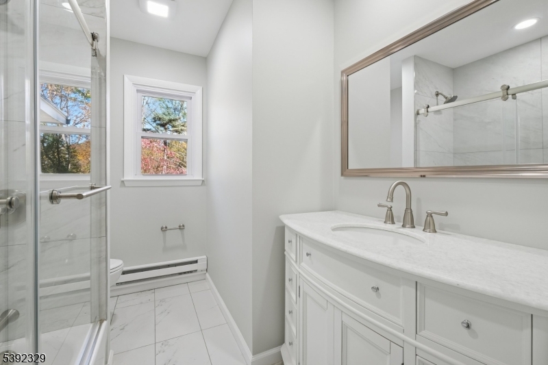 5 Weatherhill Road Lebanon, NJ 08833 - Photo 20 of 47 a bathroom with a sink a vanity and a mirror