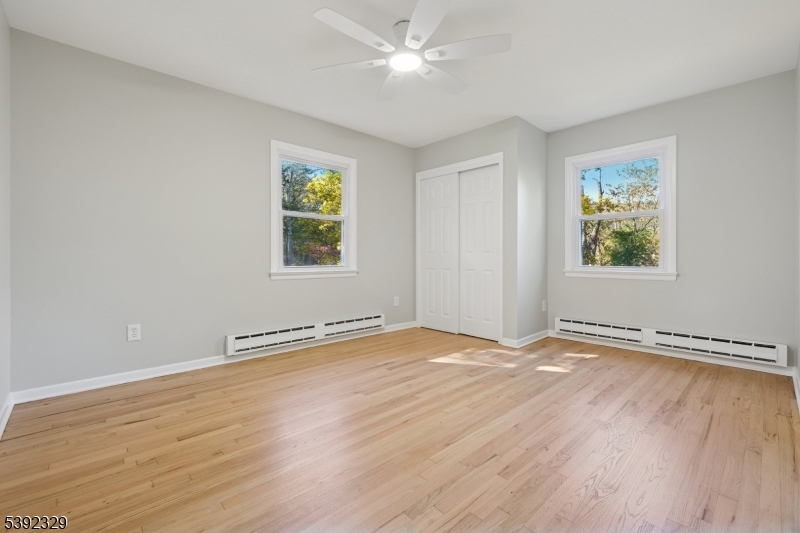 5 Weatherhill Road Lebanon, NJ 08833 - Photo 22 of 47 wooden floor in an empty room with a window