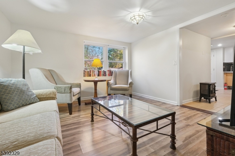 5 Weatherhill Road Lebanon, NJ 08833 - Photo 27 of 47 a living room with furniture and wooden floor