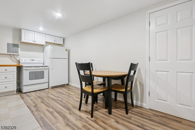 5 Weatherhill Road Lebanon, NJ 08833 - Photo 29 of 47 a view of a kitchen with a dining table and chairs