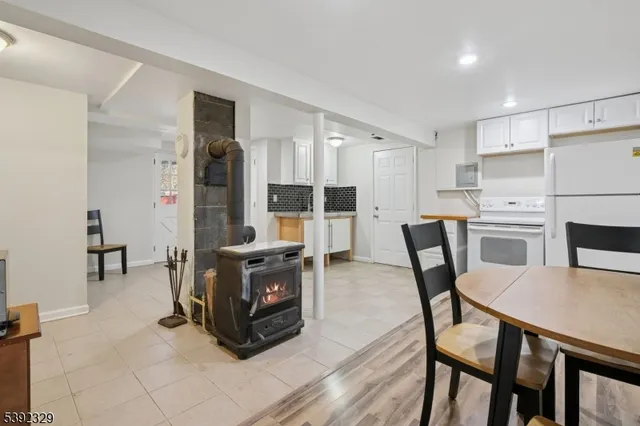 a living room with furniture a table and chairs