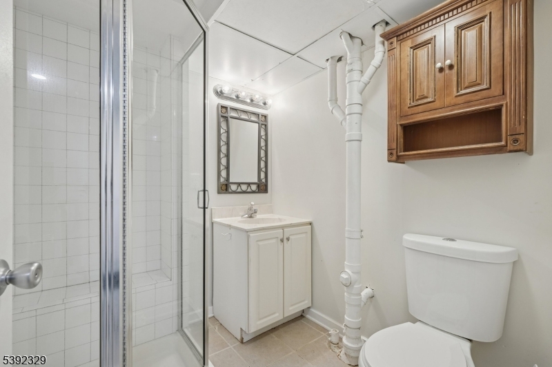 5 Weatherhill Road Lebanon, NJ 08833 - Photo 34 of 47 a bathroom with a toilet a sink and mirror