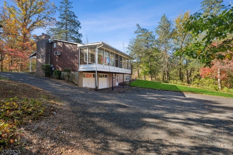 5 Weatherhill Road Lebanon, NJ 08833 - Photo 45 of 47 a front view of a house with a yard and garage