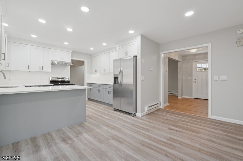 5 Weatherhill Road Lebanon, NJ 08833 - Photo 6 of 47 a kitchen with stainless steel appliances granite countertop a refrigerator and a stove top oven