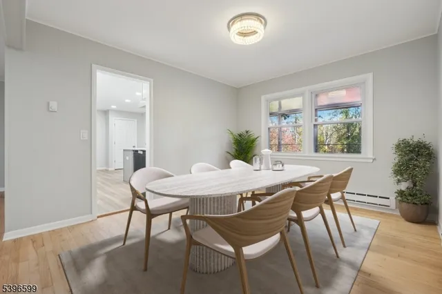 a view of a dining room with furniture and window