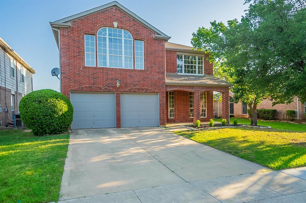 2217 Loon Lake Road Denton, TX 76210 - Photo 1 of 1 a front view of a house with a yard and garage