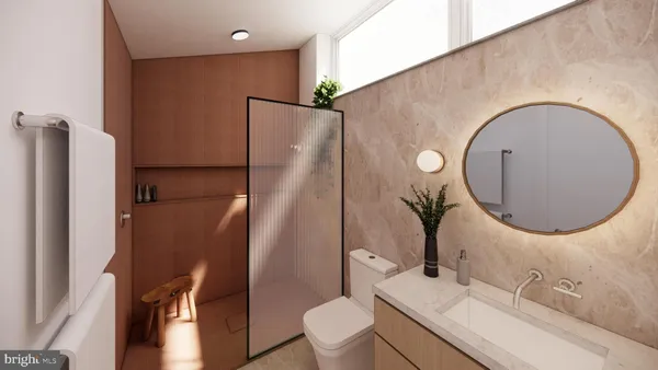 a bathroom with a sink a toilet and a mirror