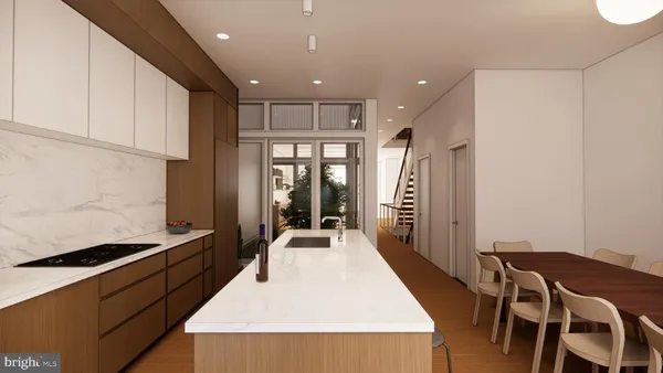 a large kitchen with a table and chairs