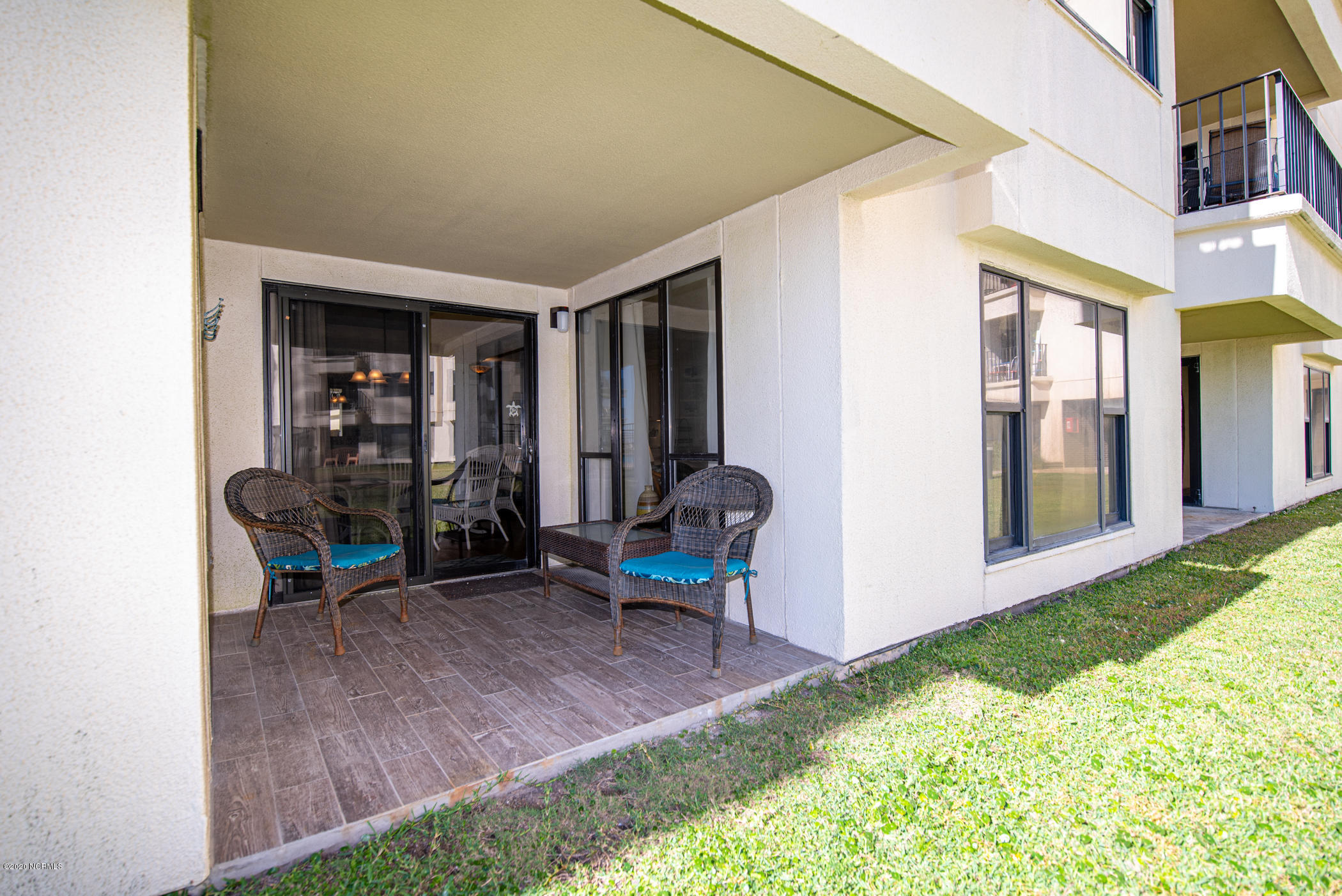 1505 Salter Path Road, Unit 135 Indian Beach, NC 28512 - Photo 27 of 43 Back patio w/seating