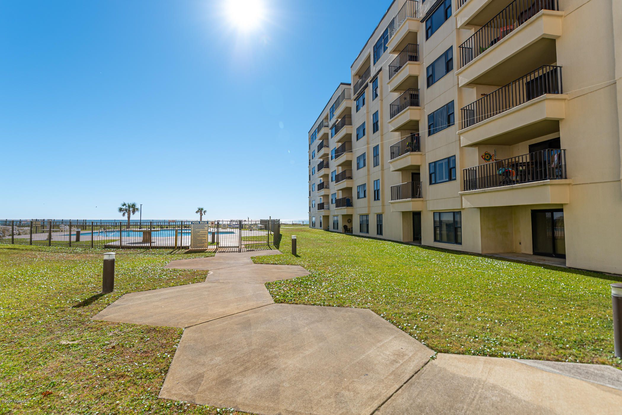 1505 Salter Path Road, Unit 135 Indian Beach, NC 28512 - Photo 30 of 43 Walkway to Pool from unit