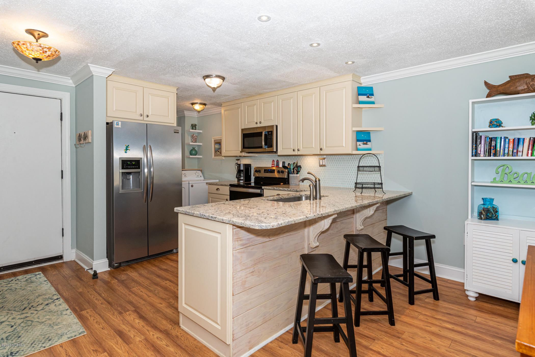 1505 Salter Path Road, Unit 135 Indian Beach, NC 28512 - Photo 6 of 43 Kitchen island w/barstools