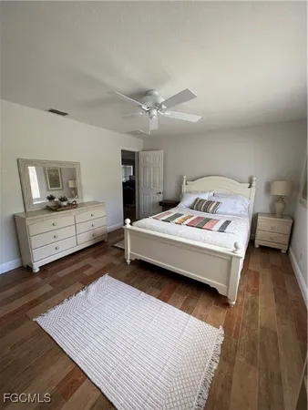 a bedroom with a bed and a view of bedroom