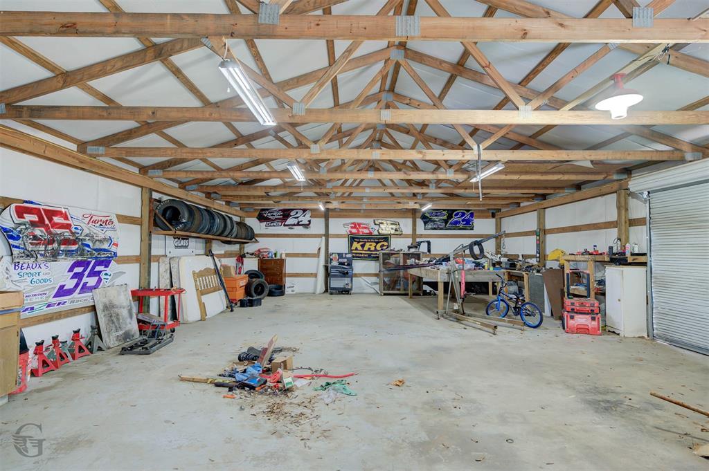 862 Par Road 116 Minden, LA 71055 - Photo 4 of 28 a view of a garage with a bike and car