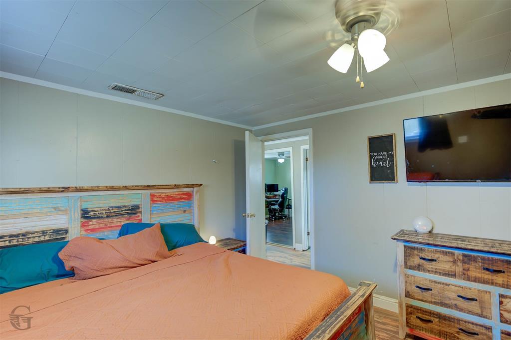 862 Par Road 116 Minden, LA 71055 - Photo 10 of 28 a bedroom with a bed and a flat tv screen on dresser