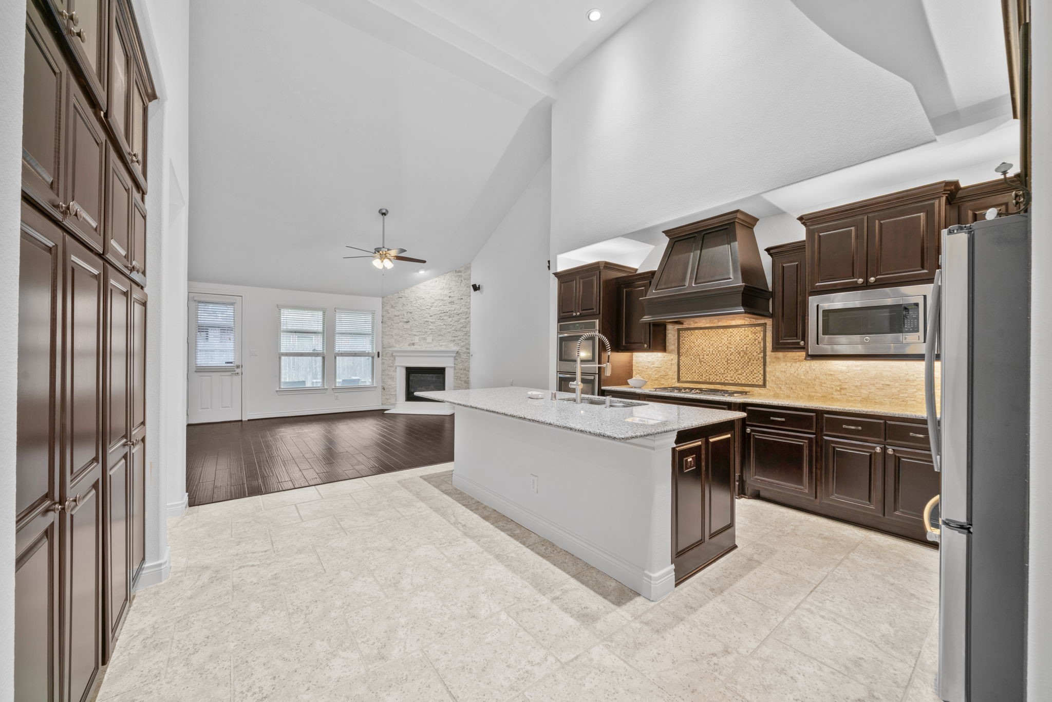 24211 Cordova Brook Lane Katy, TX 77494 - Photo 16 of 42 a kitchen with stainless steel appliances granite countertop a refrigerator and a sink