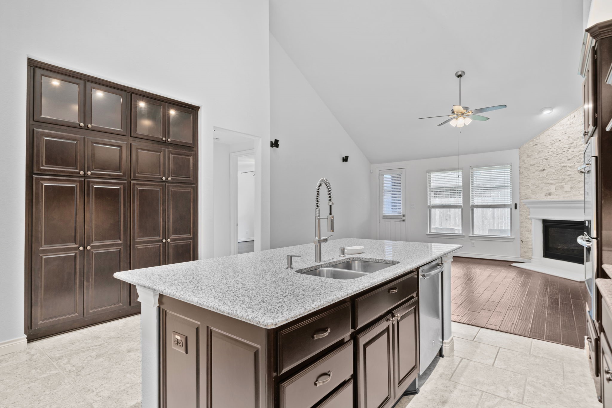 24211 Cordova Brook Lane Katy, TX 77494 - Photo 17 of 42 a kitchen with a sink and chandelier