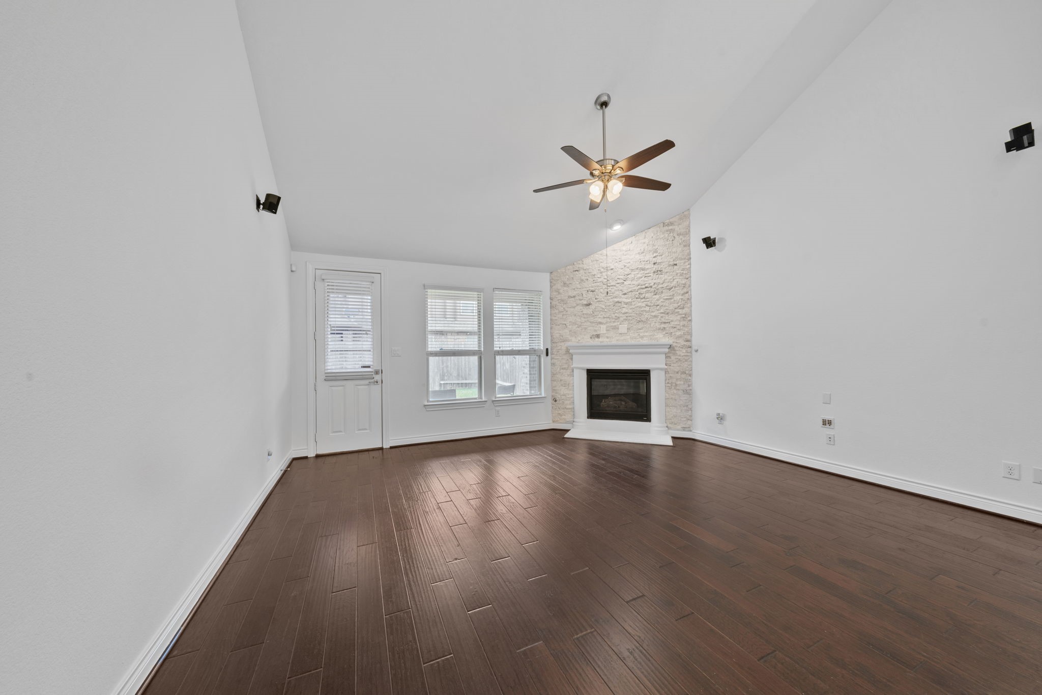24211 Cordova Brook Lane Katy, TX 77494 - Photo 19 of 42 wooden floor in an empty room with a window