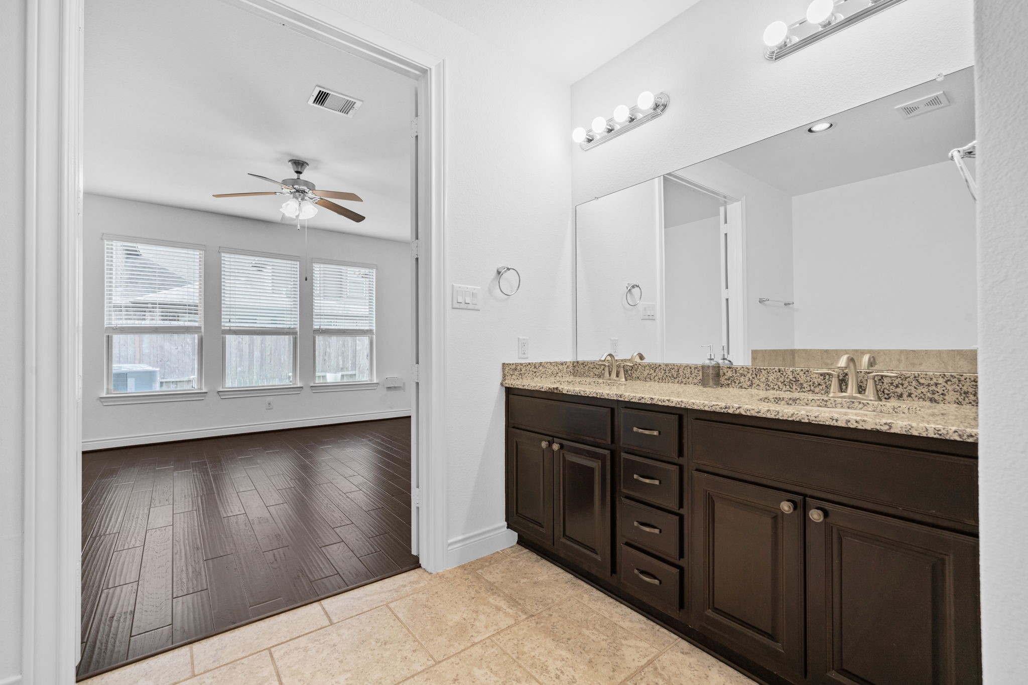 24211 Cordova Brook Lane Katy, TX 77494 - Photo 24 of 42 a bathroom with a granite countertop sink and a mirror