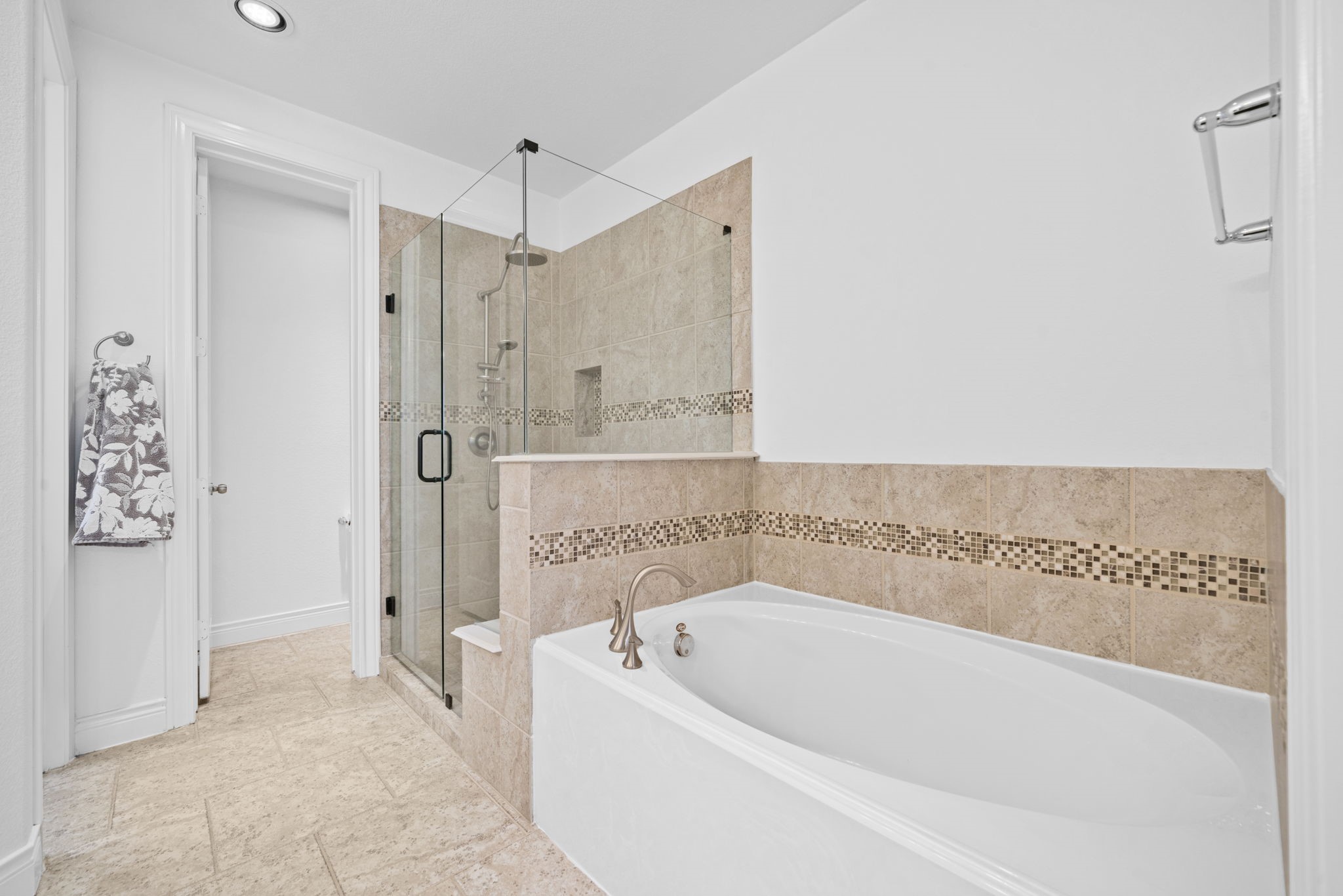 24211 Cordova Brook Lane Katy, TX 77494 - Photo 25 of 42 a bathroom with a bathtub and a shower