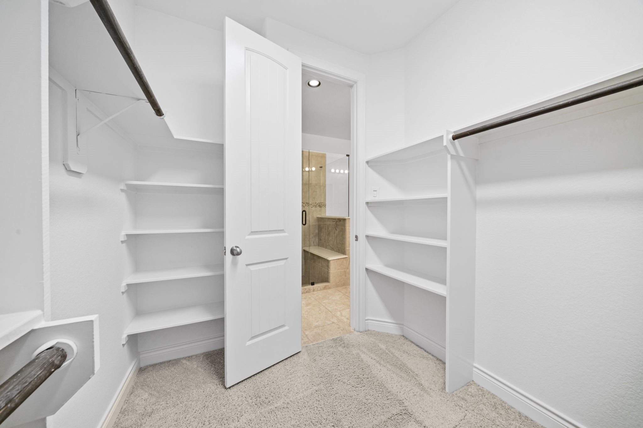 24211 Cordova Brook Lane Katy, TX 77494 - Photo 27 of 42 a view of walk in closet with empty racks