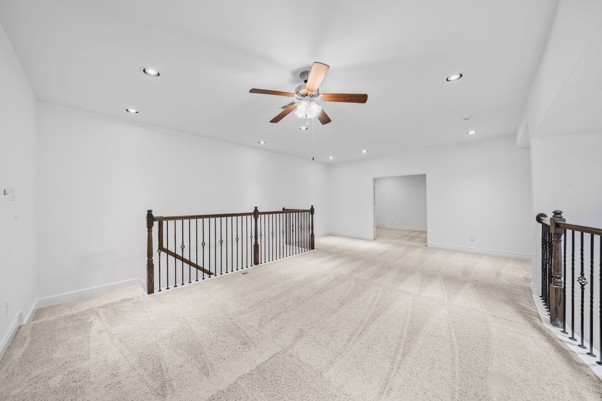 24211 Cordova Brook Lane Katy, TX 77494 - Photo 28 of 42 a view of a hallway with a ceiling fan