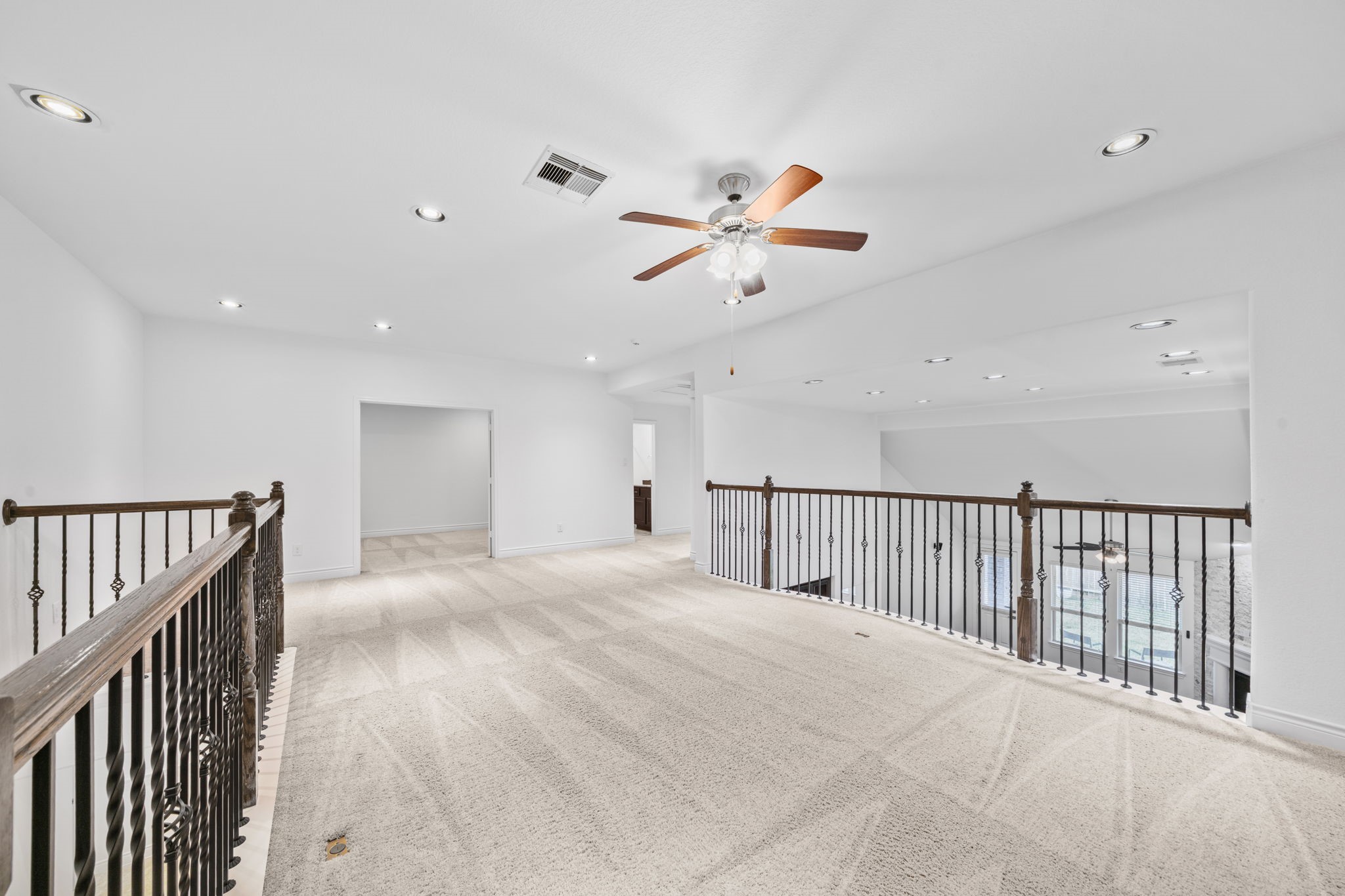 24211 Cordova Brook Lane Katy, TX 77494 - Photo 30 of 42 a view of a hallway with a ceiling fan