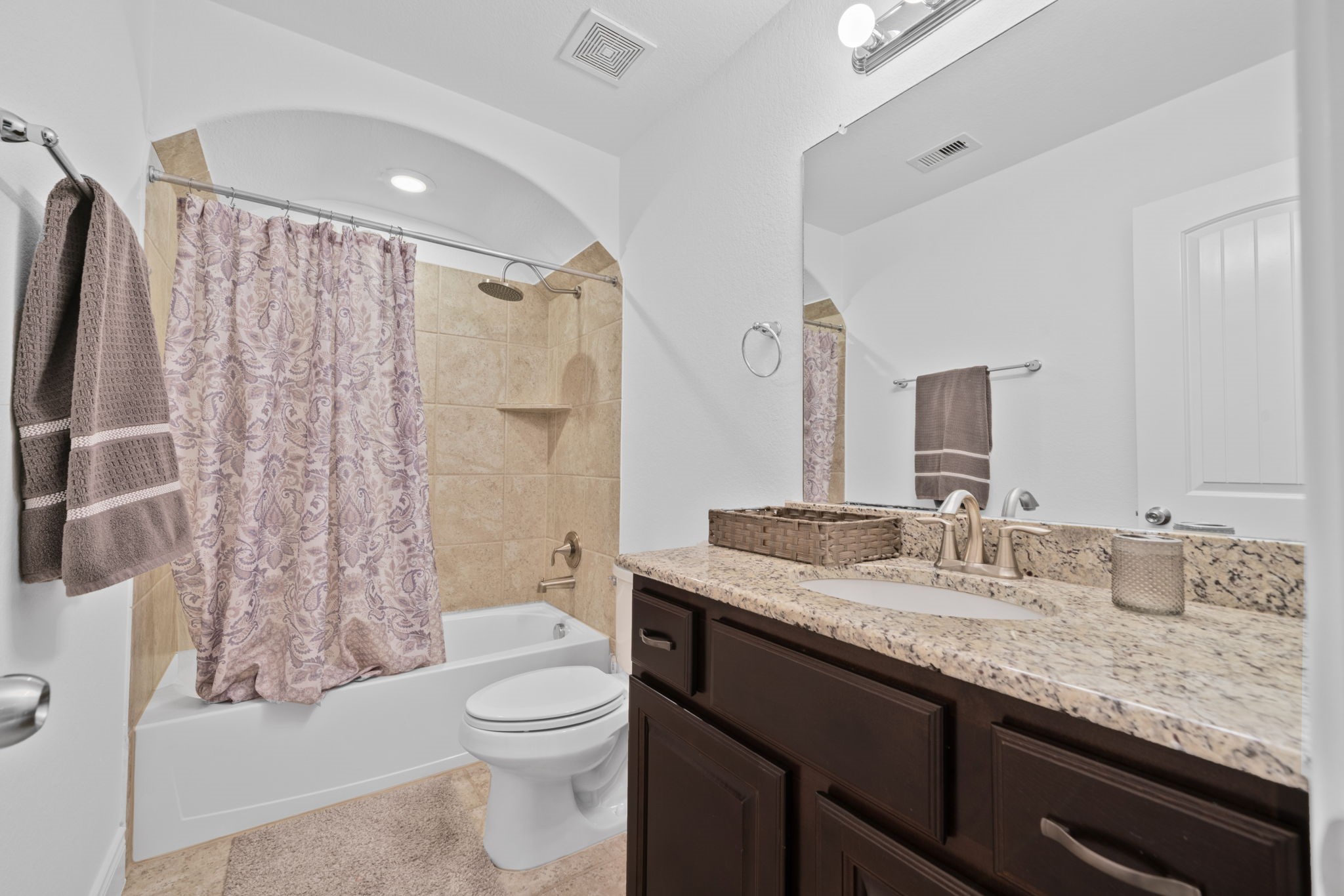 24211 Cordova Brook Lane Katy, TX 77494 - Photo 33 of 42 a bathroom with a granite countertop sink toilet and shower