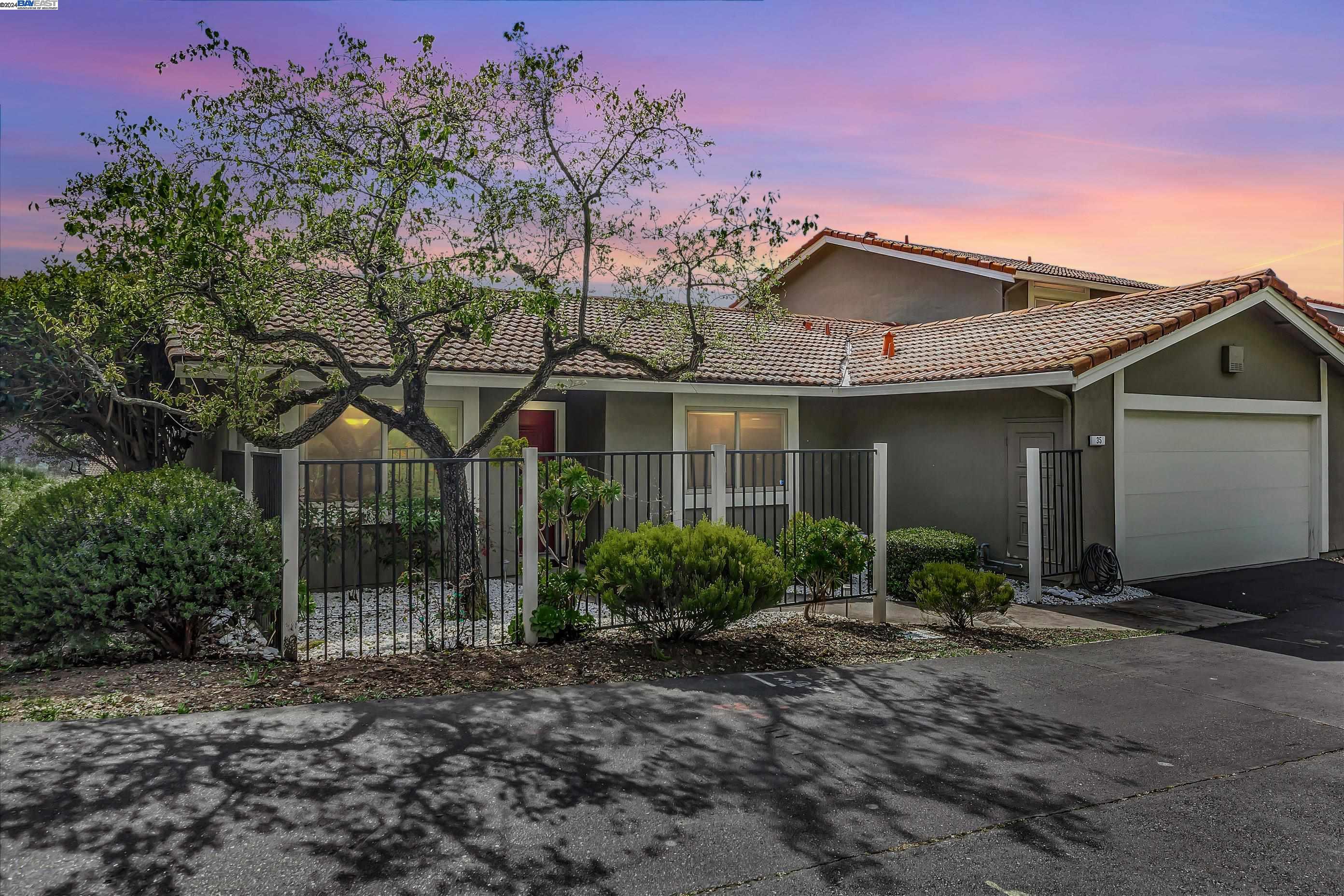 35 Shadow Mountain Oakland, CA 94605 - Photo 2 of 8 a front view of a house with garden