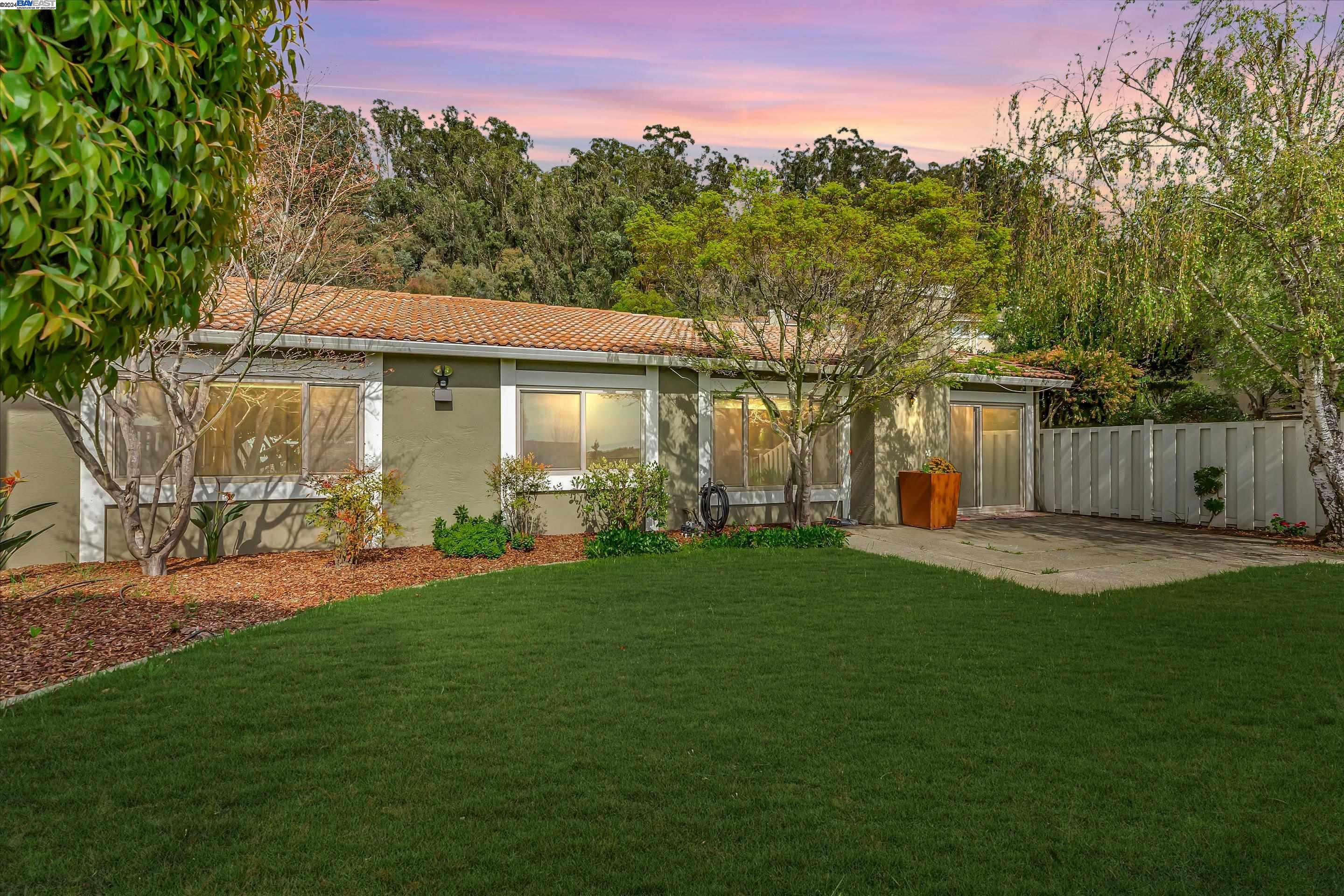 35 Shadow Mountain Oakland, CA 94605 - Photo 3 of 8 a front view of a house with a yard and trees