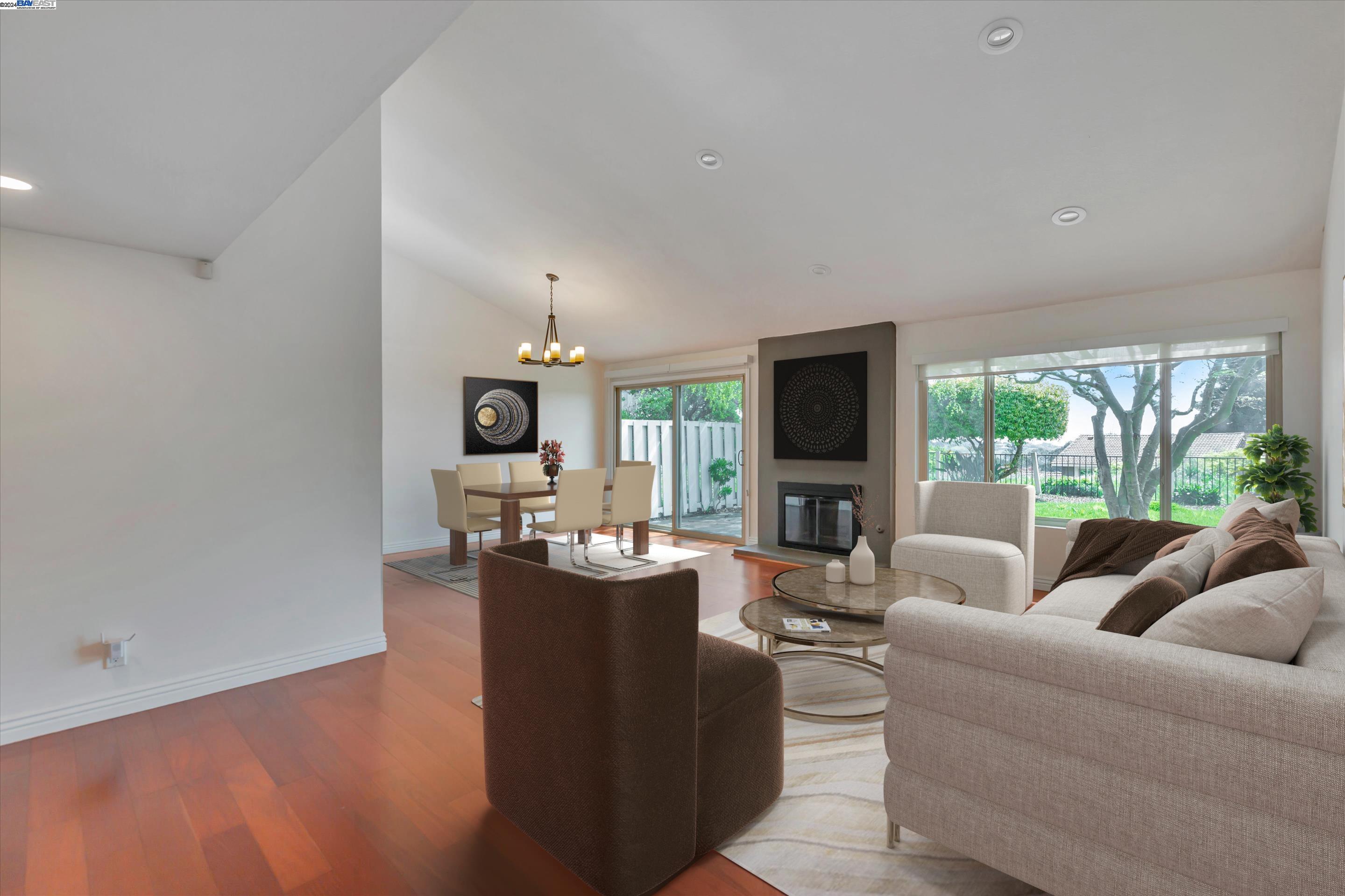 35 Shadow Mountain Oakland, CA 94605 - Photo 8 of 8 a living room with fireplace furniture and a large window