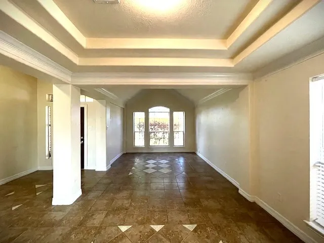 a view of a hallway with windows