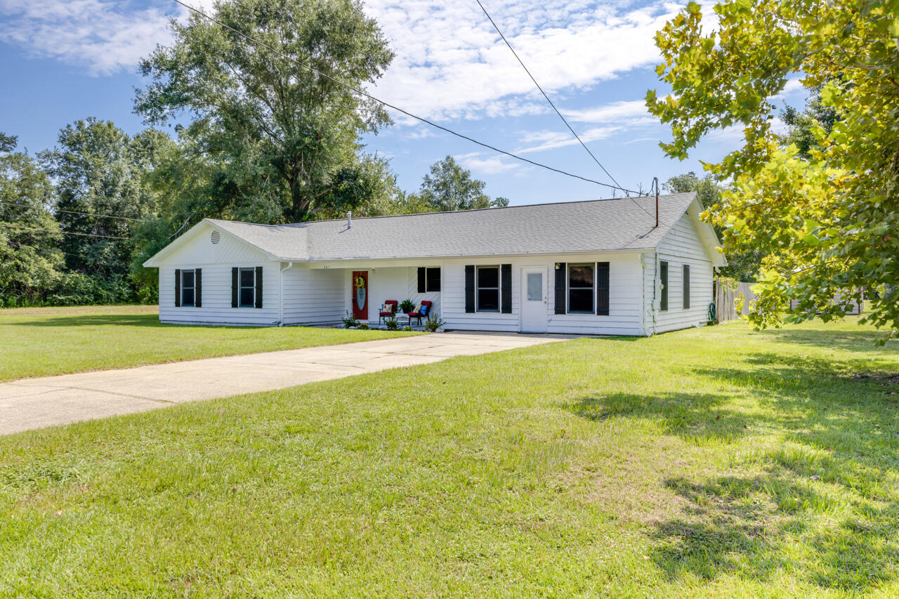 5811 Monroe Street Baker, FL 32531 - Photo 1 of 33 a house view with swimming pool in front of it