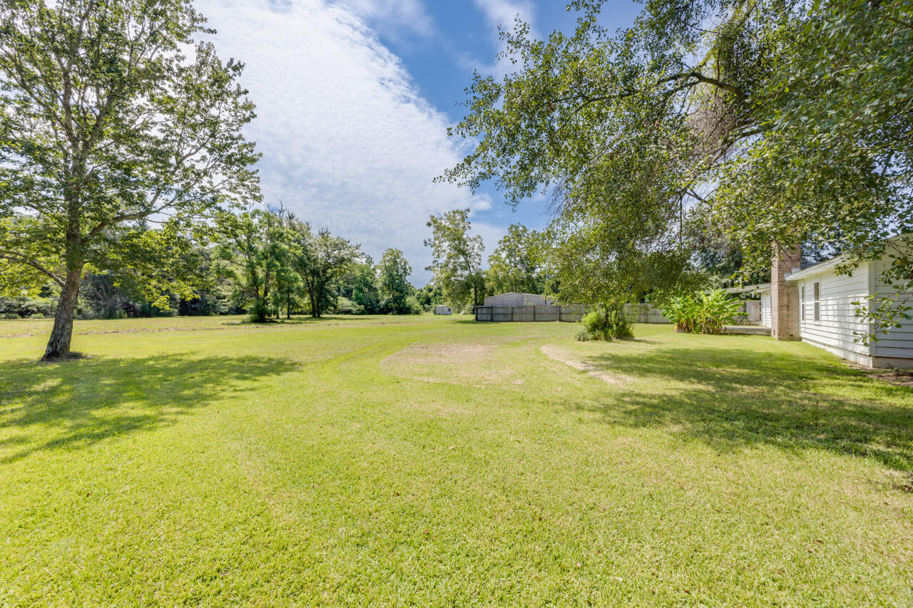 5811 Monroe Street Baker, FL 32531 - Photo 2 of 33 a view of outdoor space with garden and trees