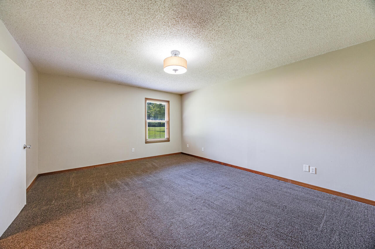5811 Monroe Street Baker, FL 32531 - Photo 21 of 33 an empty room with a empty space and a window