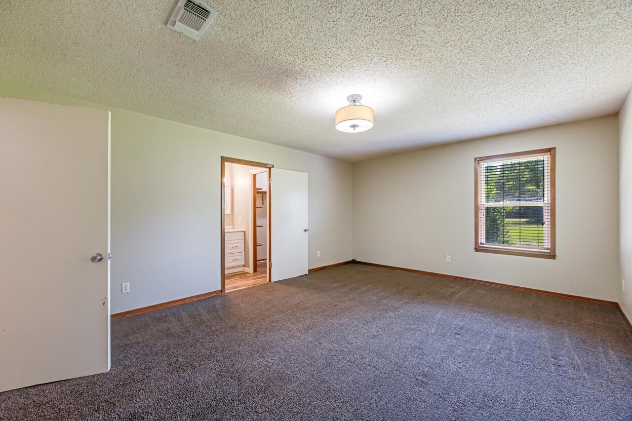 5811 Monroe Street Baker, FL 32531 - Photo 22 of 33 an empty room with a empty space and windows
