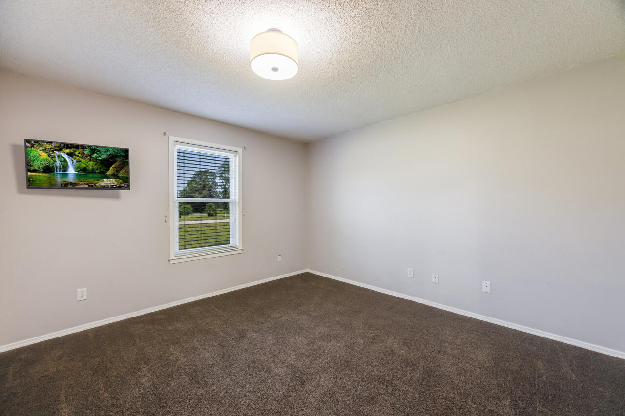 5811 Monroe Street Baker, FL 32531 - Photo 24 of 33 an empty room with windows