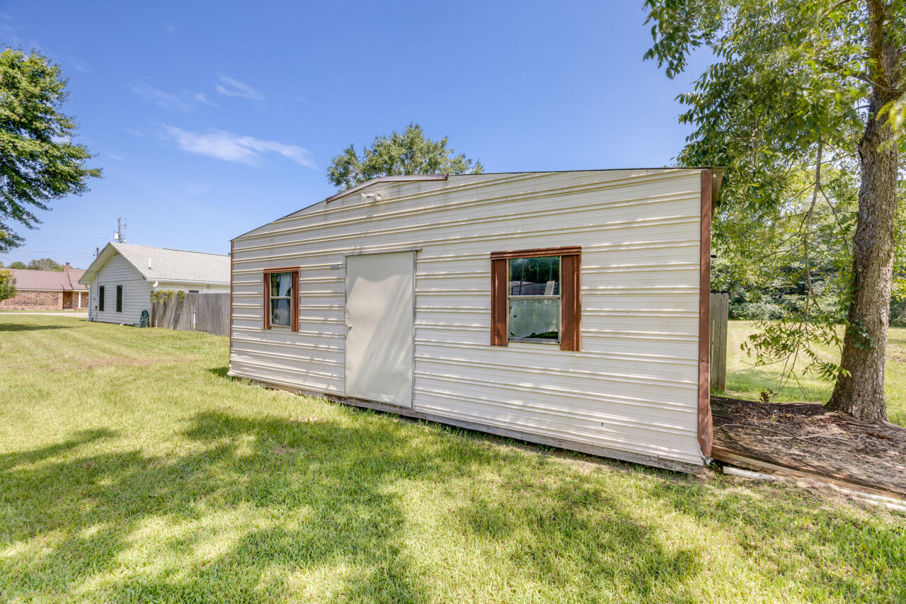 5811 Monroe Street Baker, FL 32531 - Photo 32 of 33 a front view of a house with garden