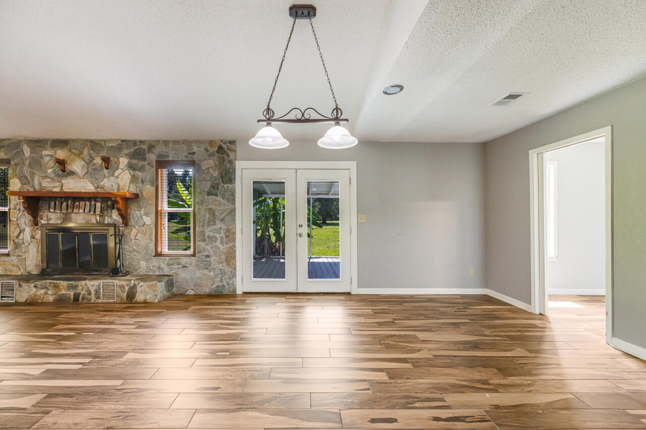 5811 Monroe Street Baker, FL 32531 - Photo 5 of 33 a view of a livingroom with furniture window and wooden floor